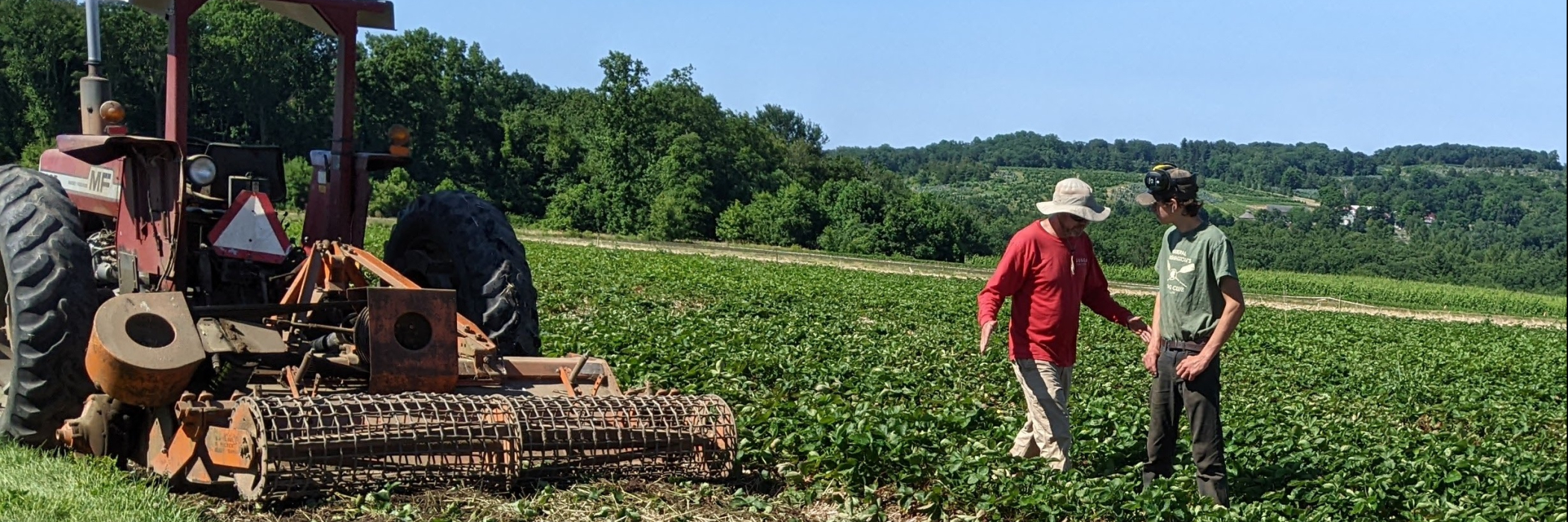 Jamie and Sam Jones working in the fields at Pumpkinseed Hill