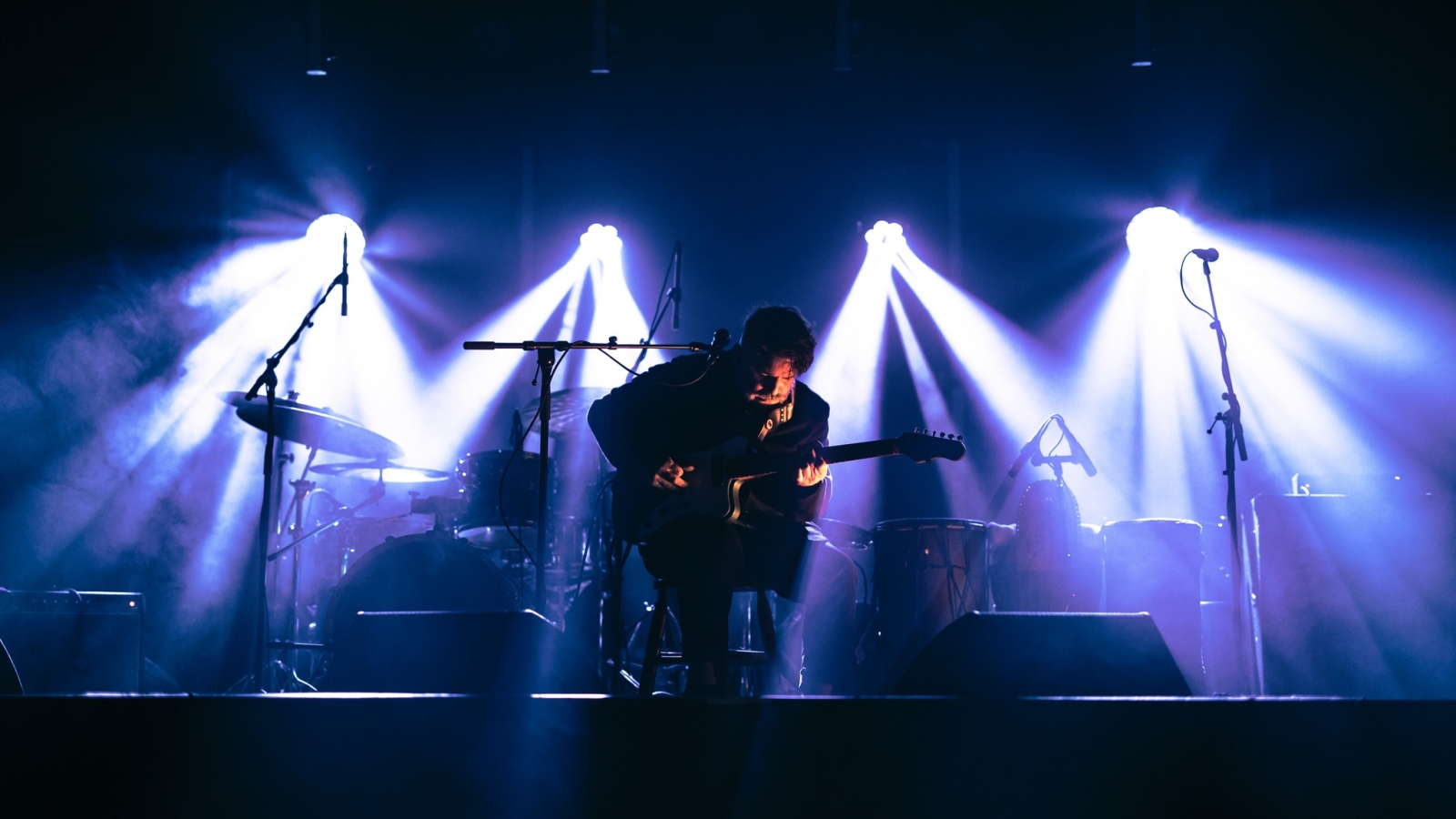 Chris Cavaliere on stage under the lights