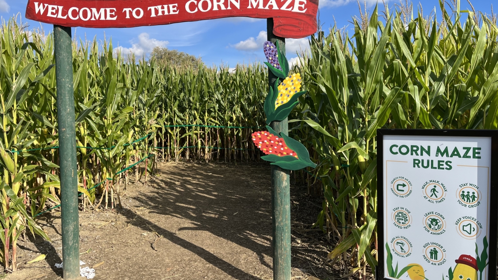 Welcome to the Corn Maze sign in front of maze