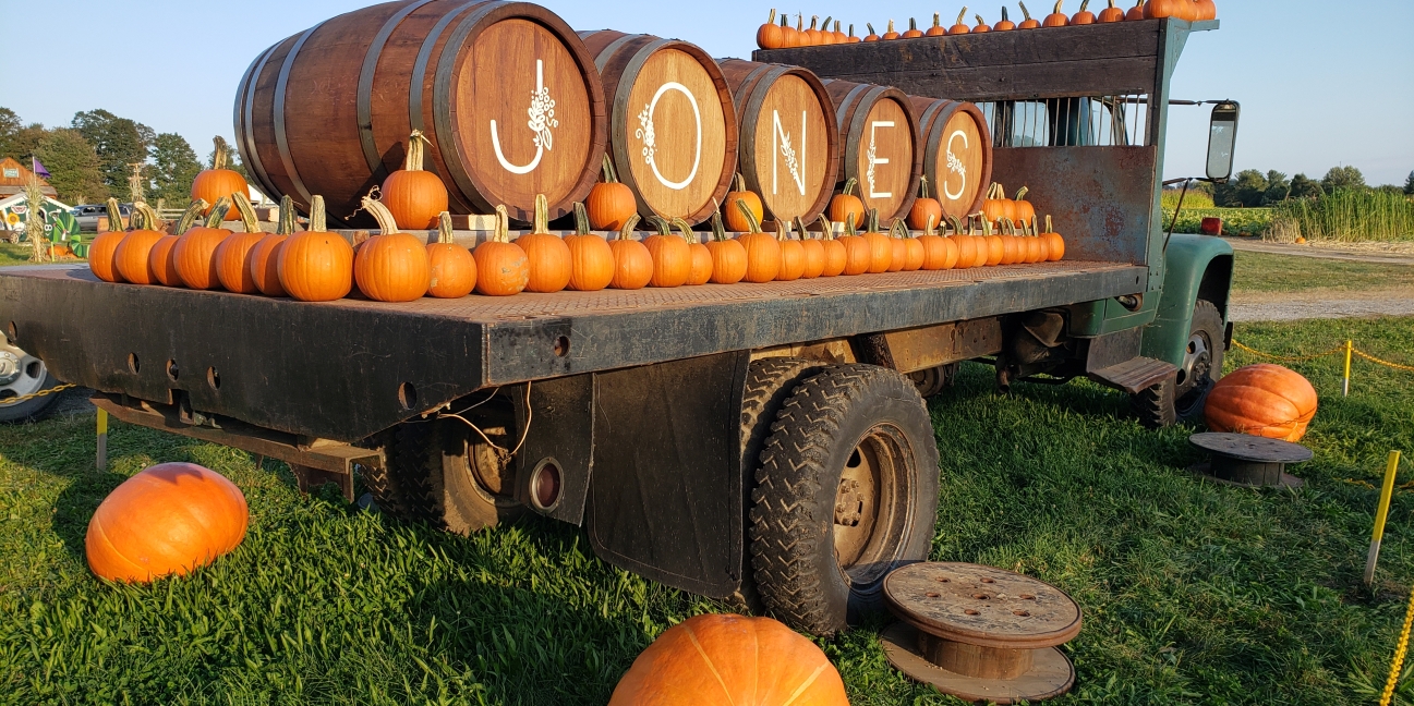 Kegs spell J-O-N-E-S on back of truck with pumpkins