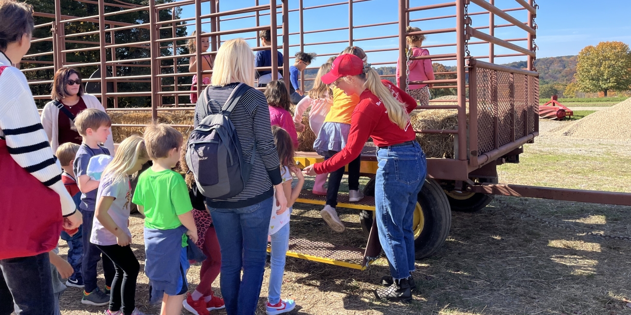 school loading on a hay wagon