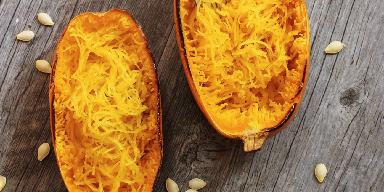 Roasted Spaghetti Squash with Herbs on a wooden table