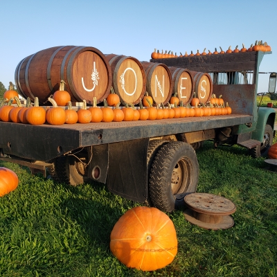 Kegs spell J-O-N-E-S on back of truck with pumpkins