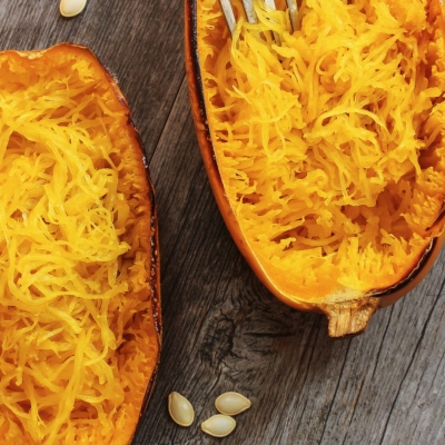 Roasted Spaghetti Squash with Herbs on a wooden table