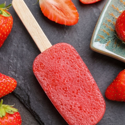 Strawberry Pops on the counter with fresh strawberries