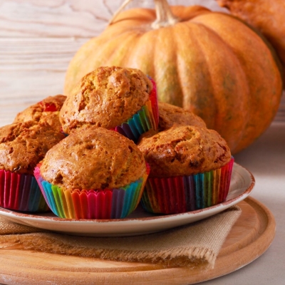 a plate of stacked Pumpkin-Oat Mini Muffins