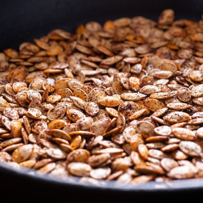 a skillet of Roasted Pumpkin Seeds