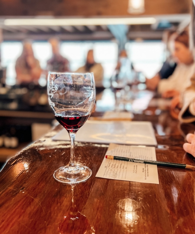 halve full glass of wine in the tasting room