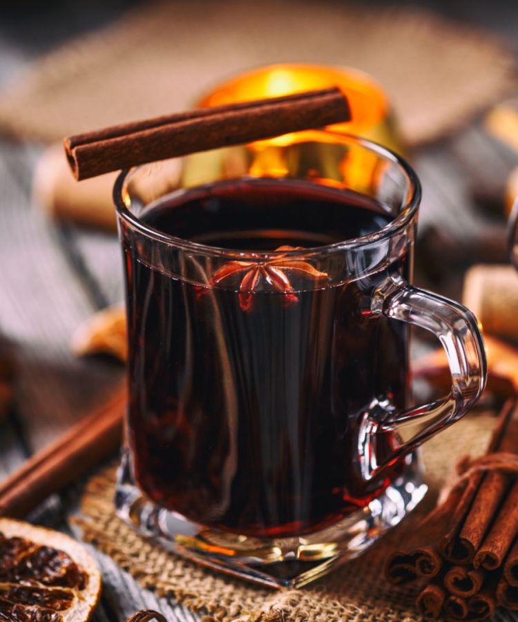 Jones Mulled Wine in a mug with cinnamon sticks